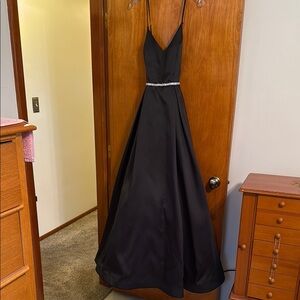 B Darlin black gown with faux crystal waist. Size 15/16. New without tag